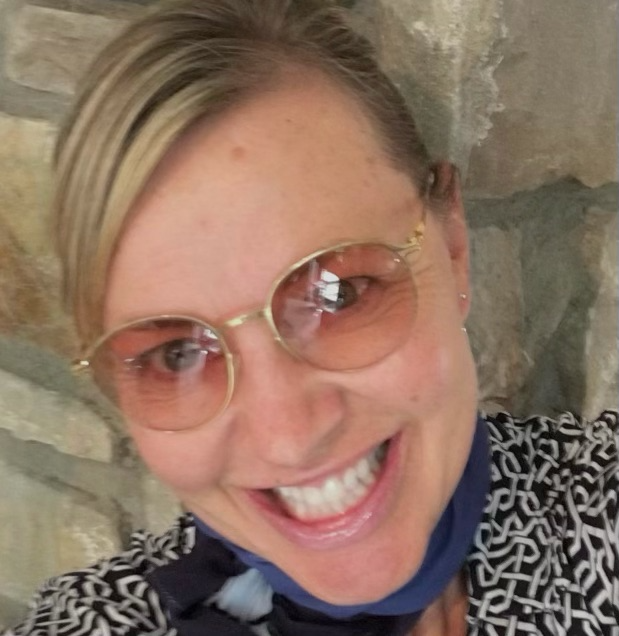 A woman in a bow tie wearing designer glasses from Eye Glasses Durango, CO.
